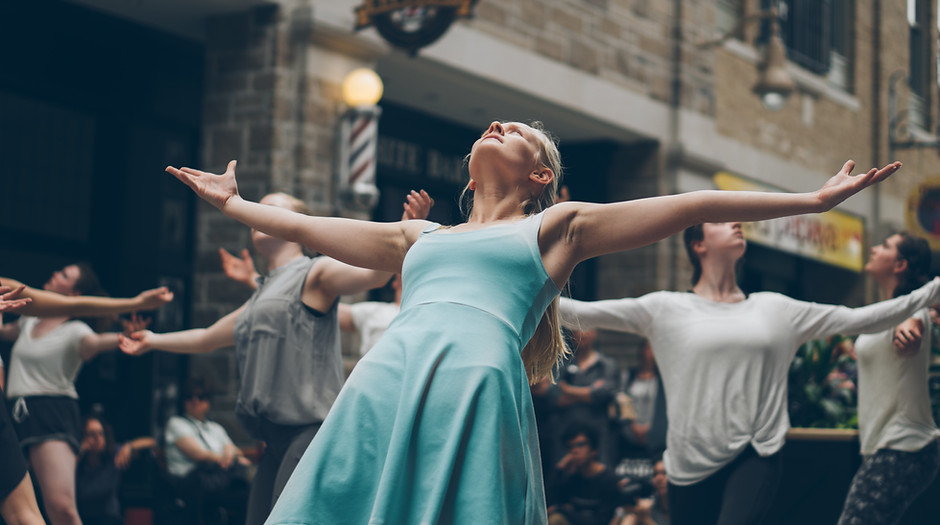 A dancer in a blue outfit