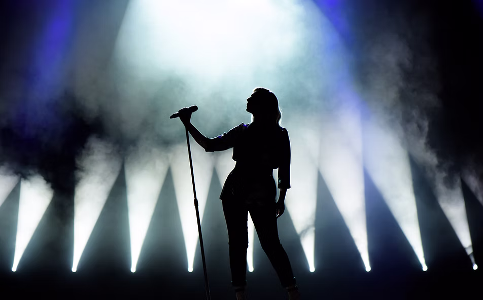 A lone singer on a stage